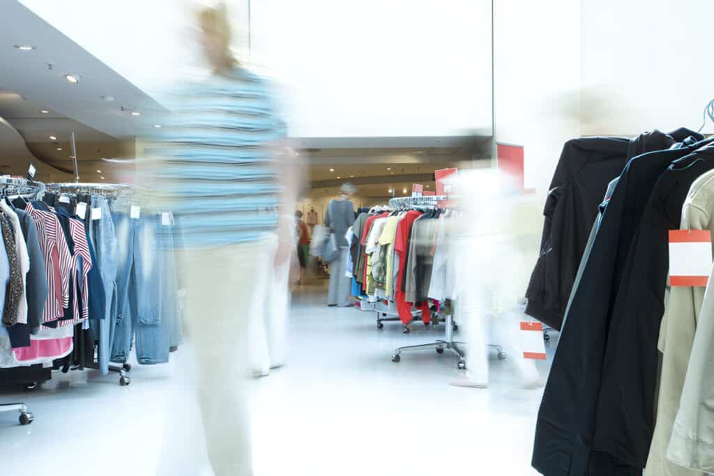 Convert more visits into sales 16 blurred customer in a clothing store
